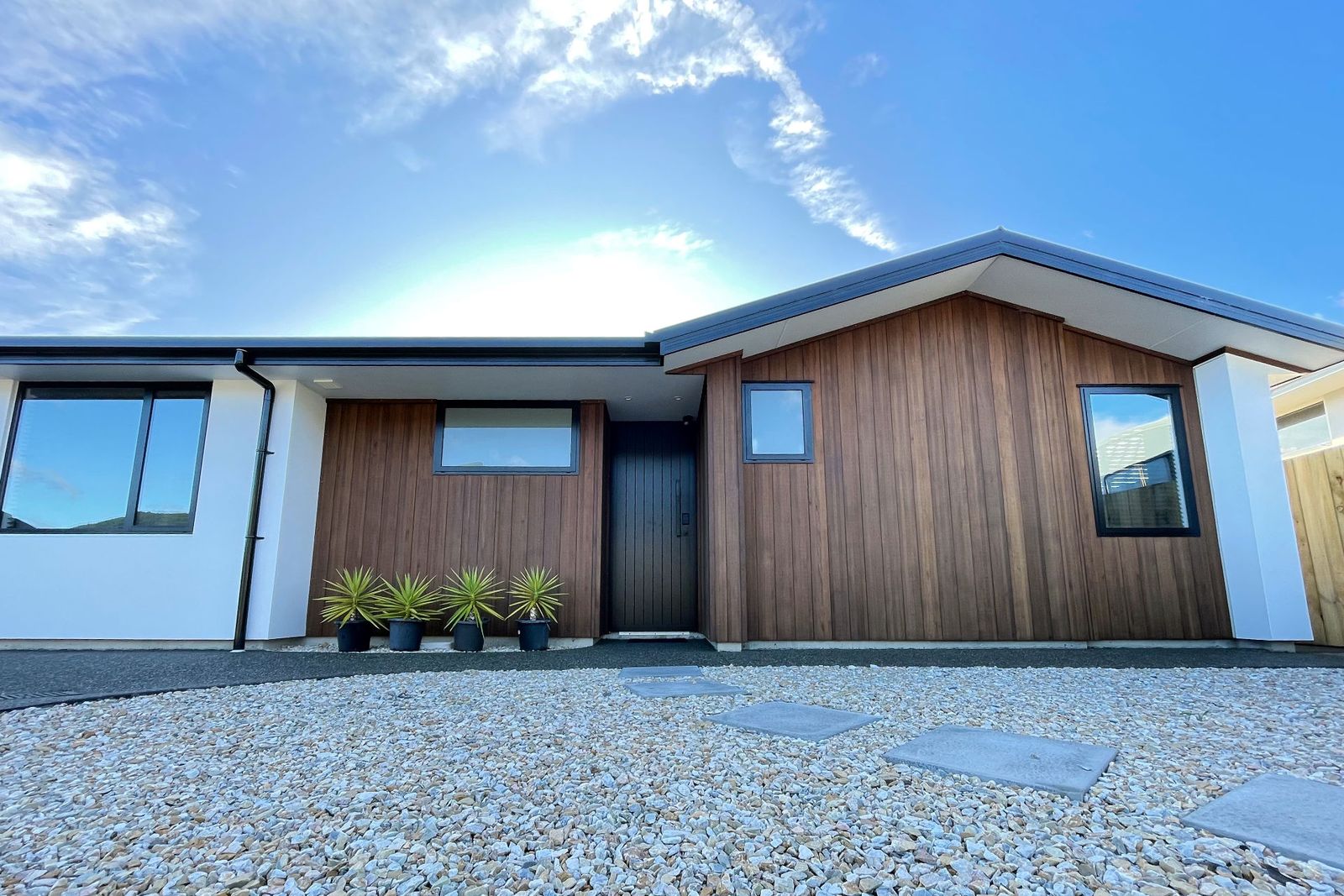 Newly built Nelson home with vertical cedar cladding and a dark gable roof